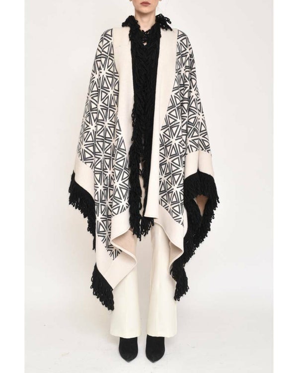GEOMETRIC PRINT CAPE WITH FRINGES LIMITED EDITION