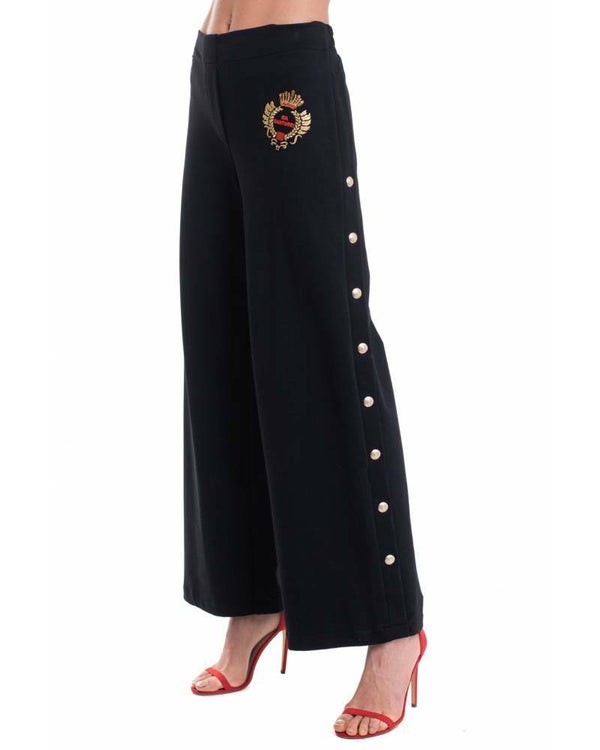 TROUSERS WITH DECORATIVE PRESS BUTTONS ON THE SIDES