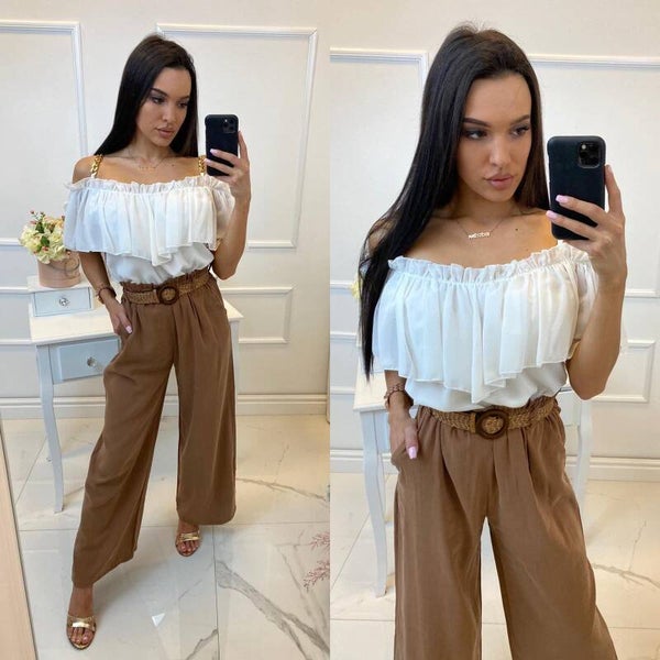 nice blouse, gold chains on shoulders