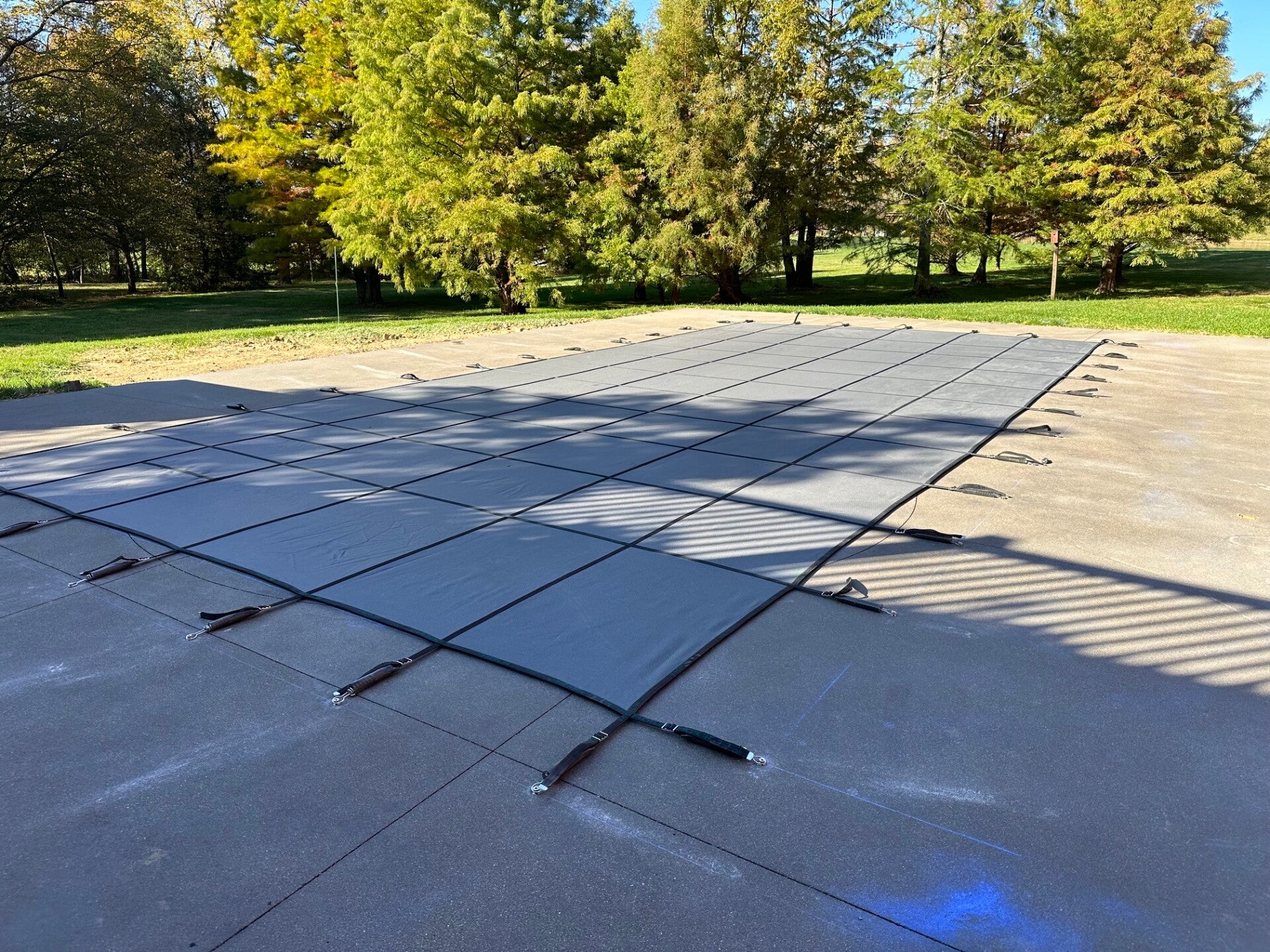 Pool secured with its winter safety cover