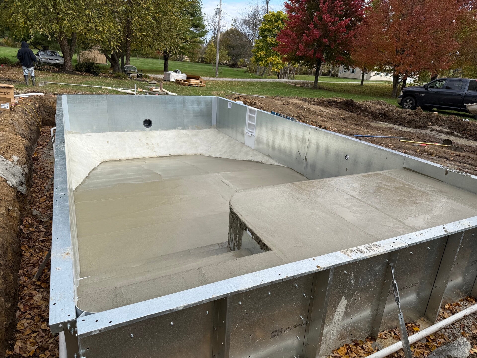 Custom entry steps and sun deck taking shape during a Rainbow Pools installation.