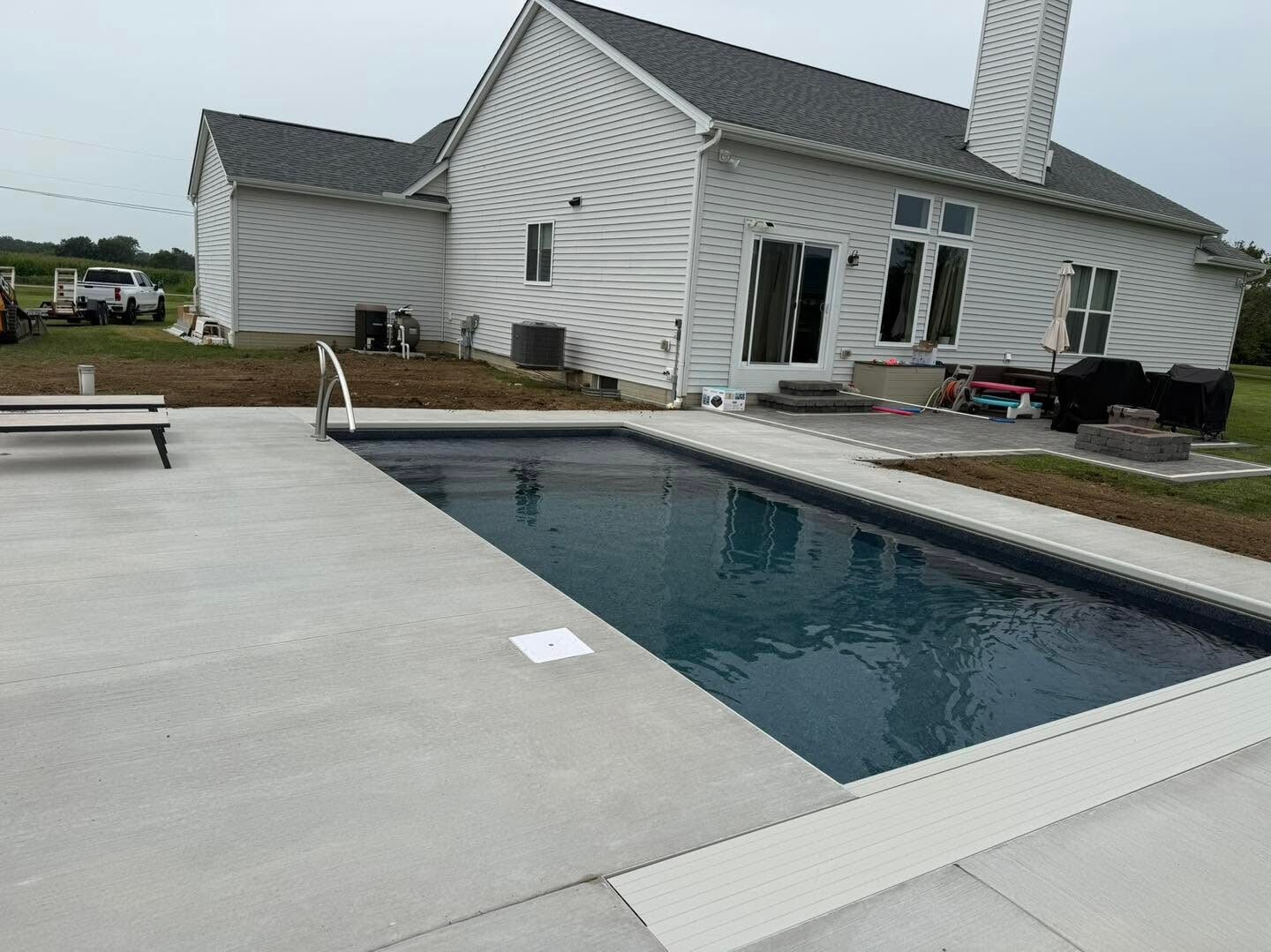 Another view of the same pool and its patio beside the home.