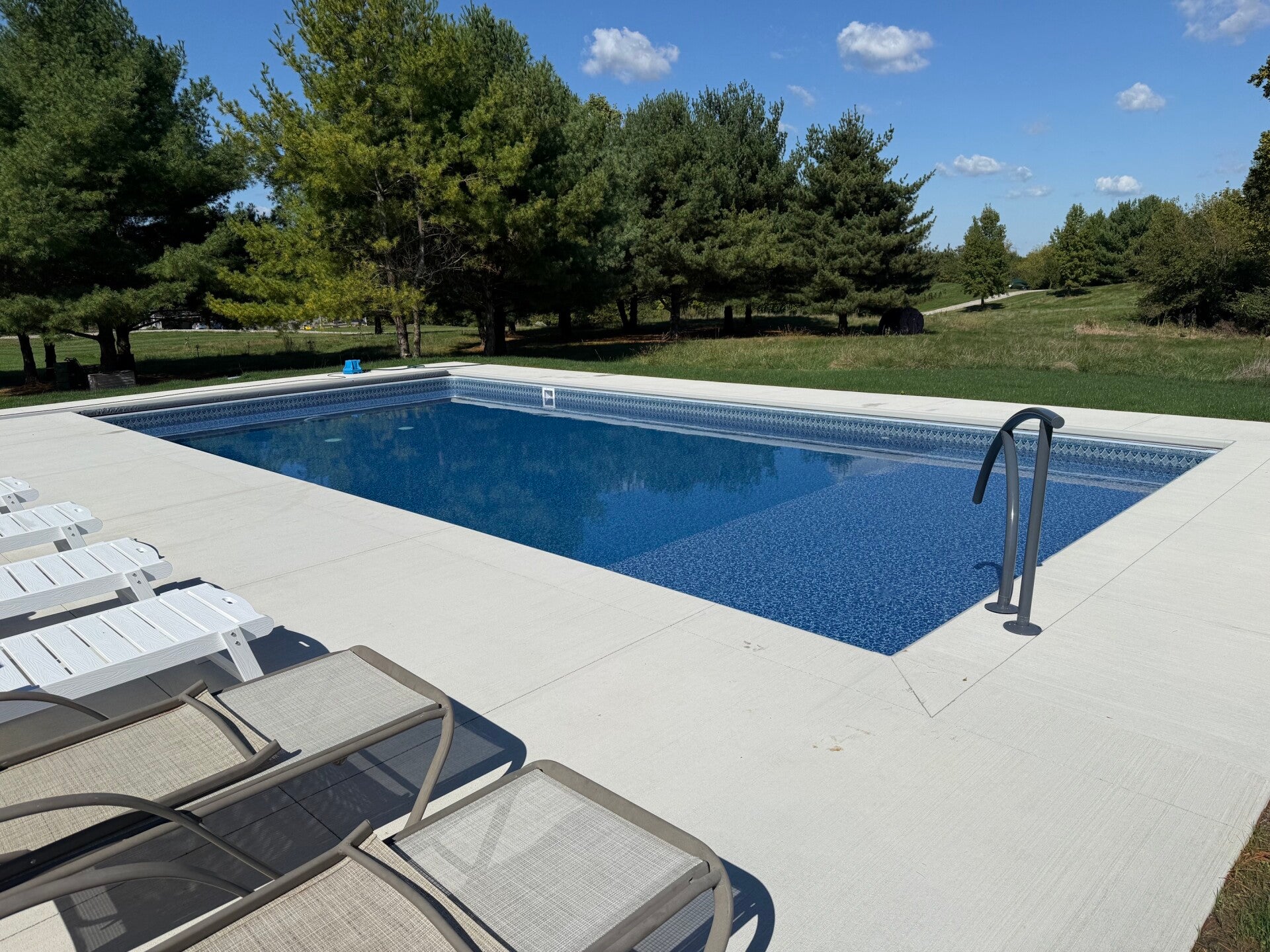 Finished Rainbow Pools vinyl liner pool and patio