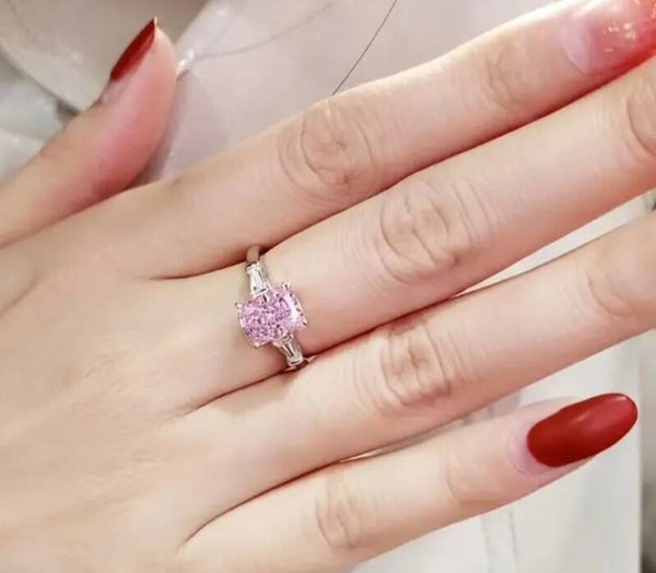 Elegant Pink Cushion-Cut Three-Stone Ring
