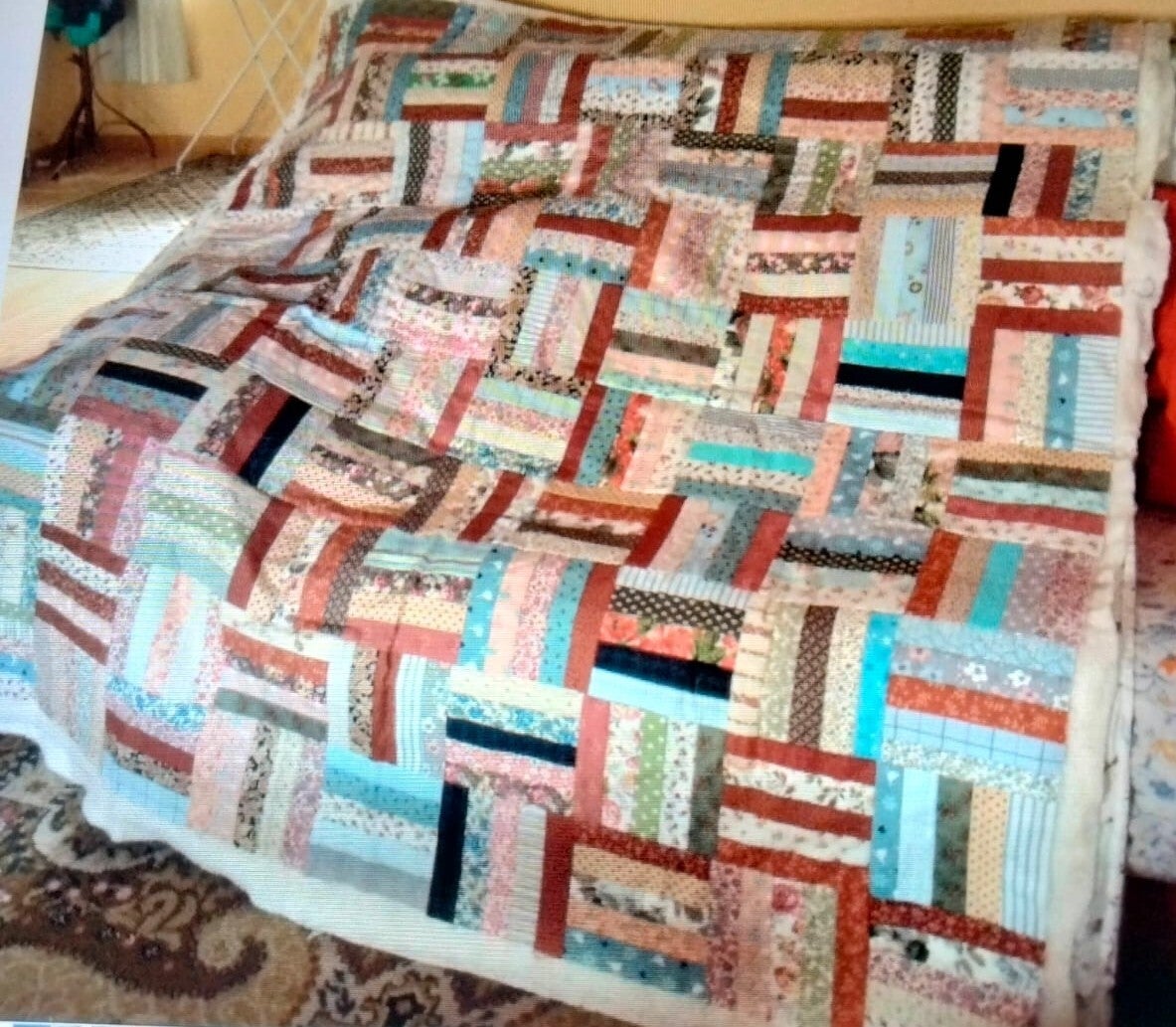 Manta de recuerdos confeccionada con ropa de bebé y tejidos familiares