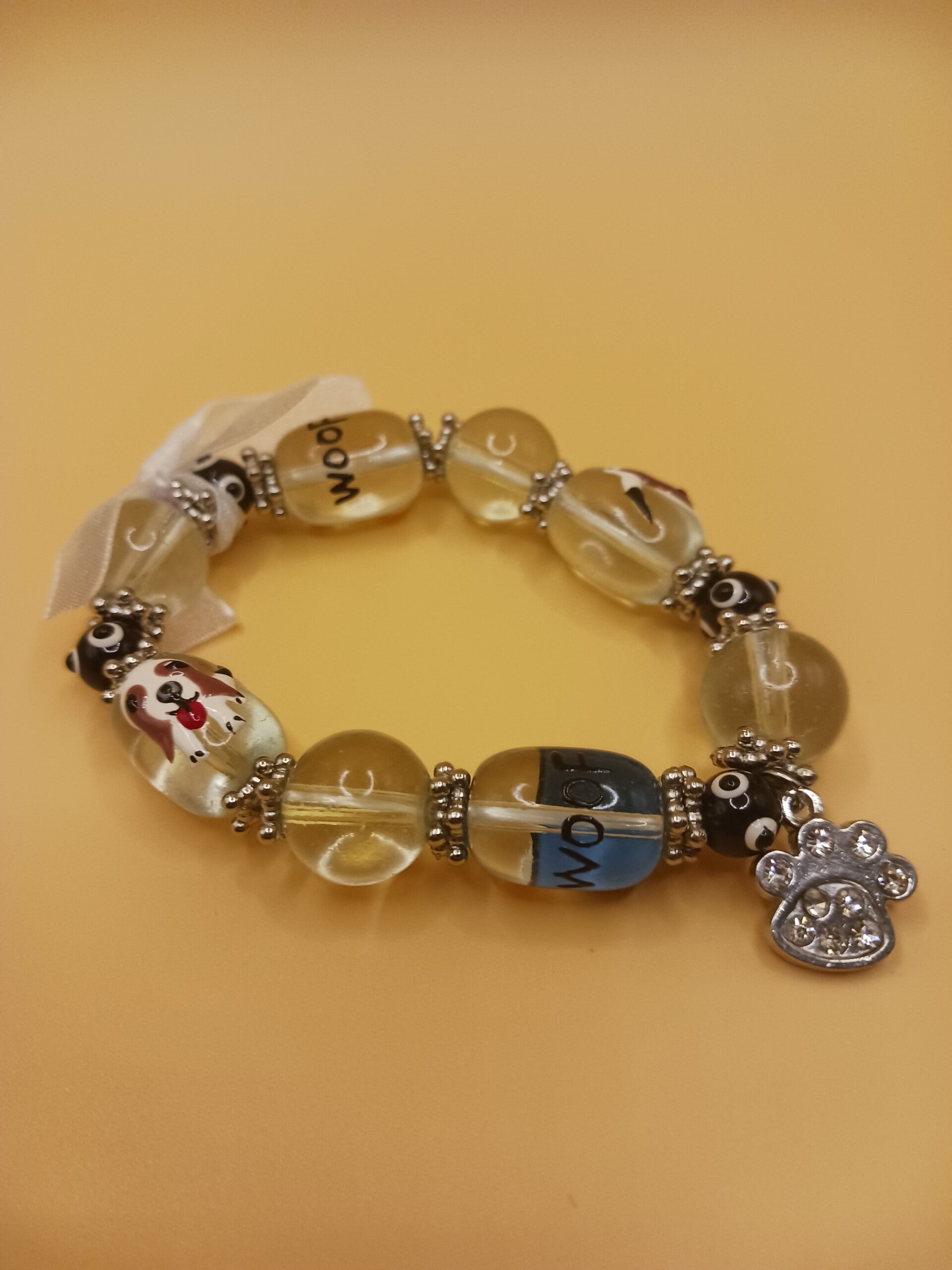 Dog-Themed Woof Beads Bracelet with Silver Paw Charm