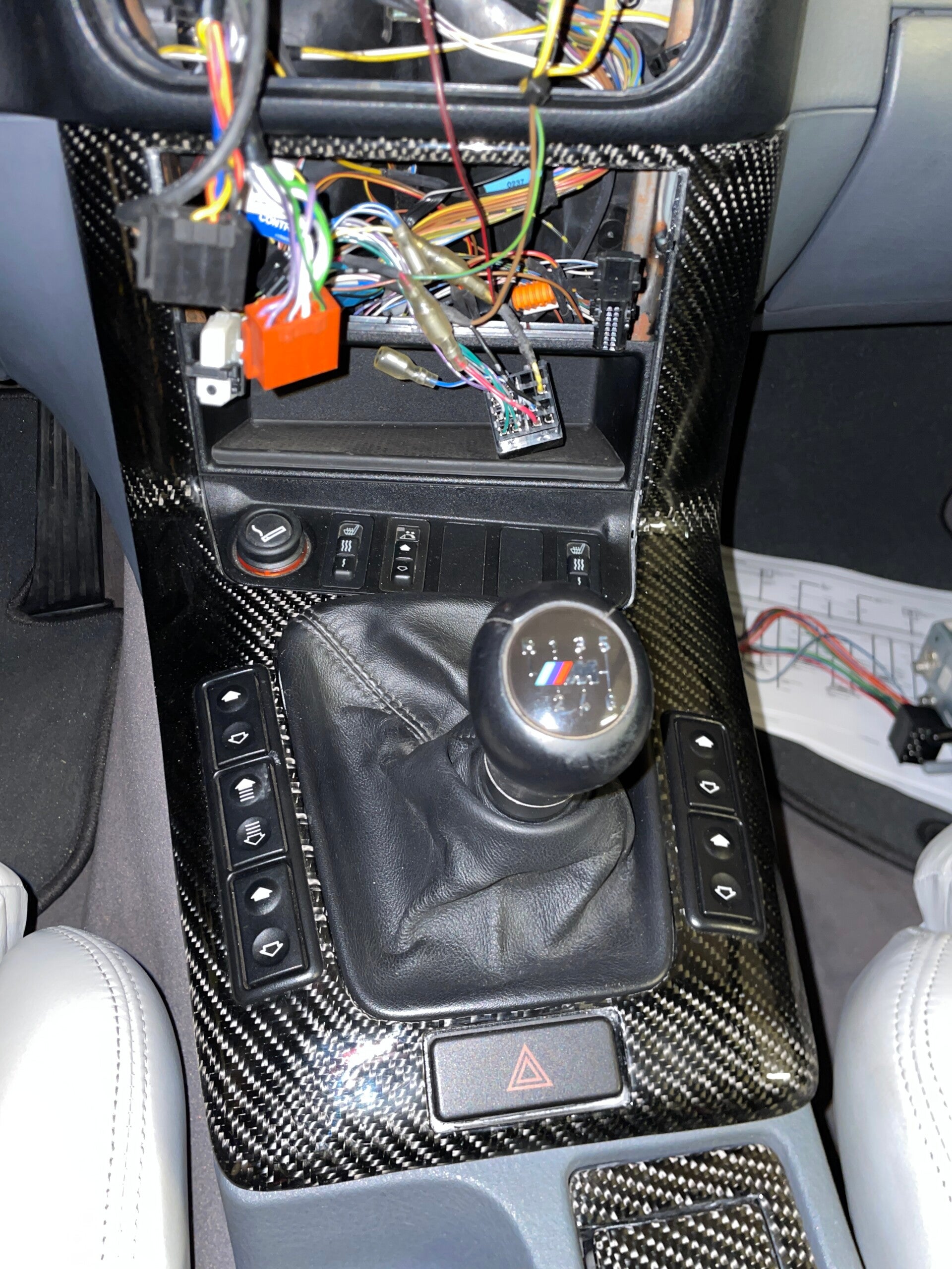 Swedish handcrafted carbon fiber interior trim for cars  Close up of carbon fiber car trim detail  Luxury car interior with carbon fiber trim