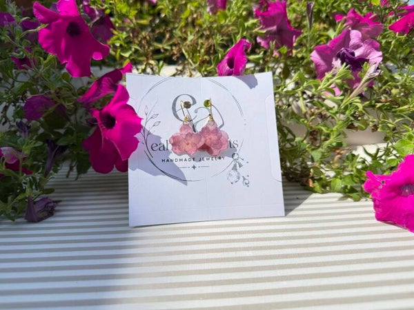 small earrings made with real flowers preserved in resin