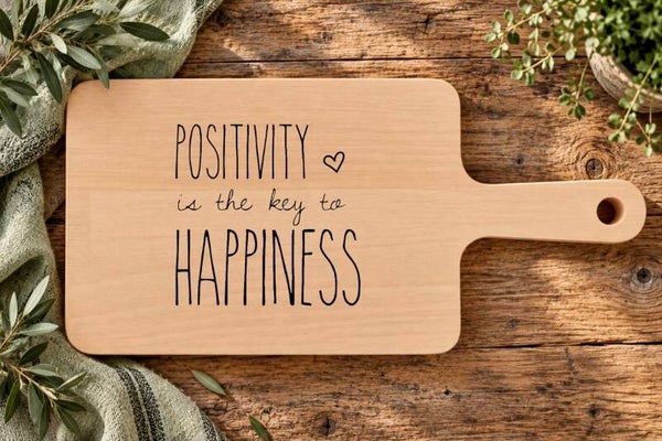 Ontbijtplankje : Positivity is the key to happiness