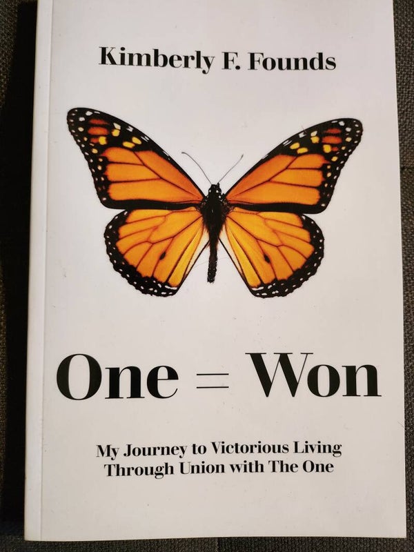 One = Won softcover book
