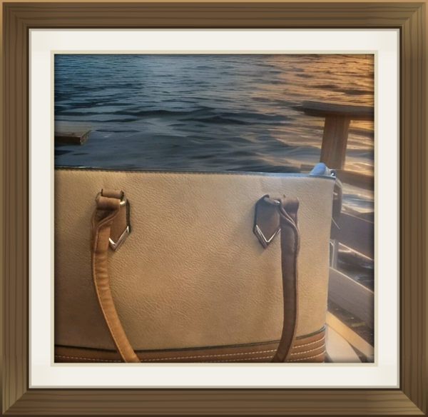 Large brown and beige hand bag.