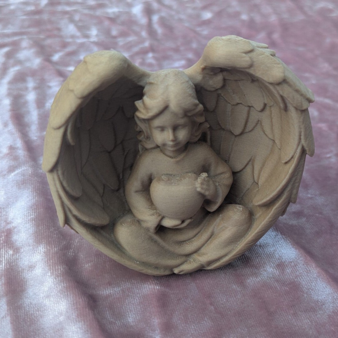 Angel Holding Heart Sculpture