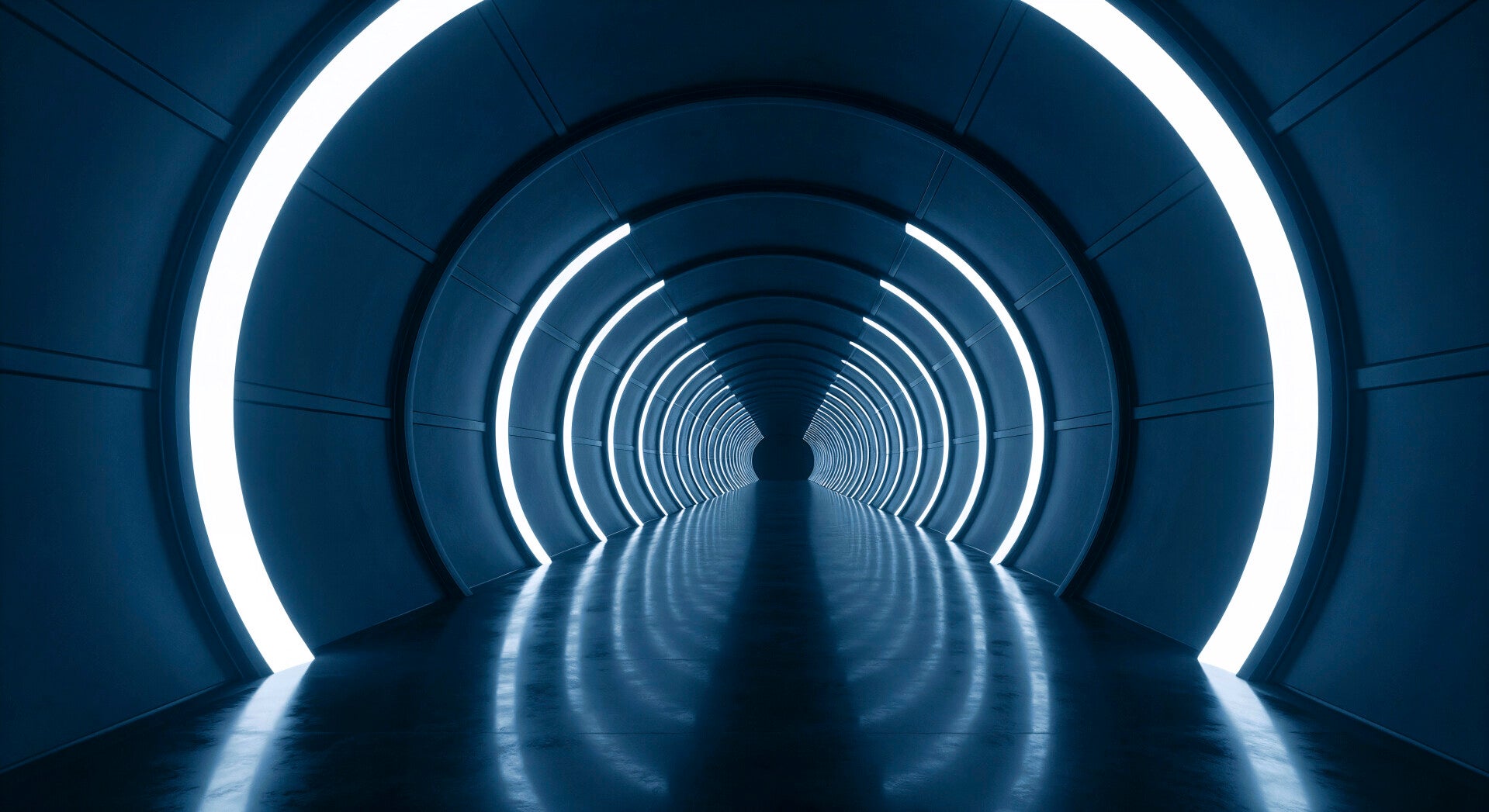 Futuristischer Tunnel mit runden, leuchtenden Neonringen und spiegelnder Bodenfläche, im Kontext mit Jenseitskontakte Jana Lorenz - Blog.