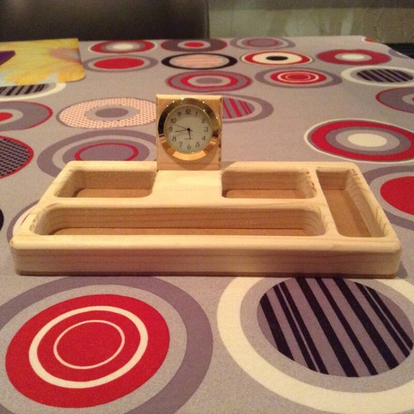 Houder voor op bureel