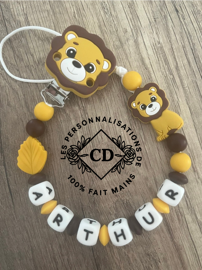 Attache tétine lion