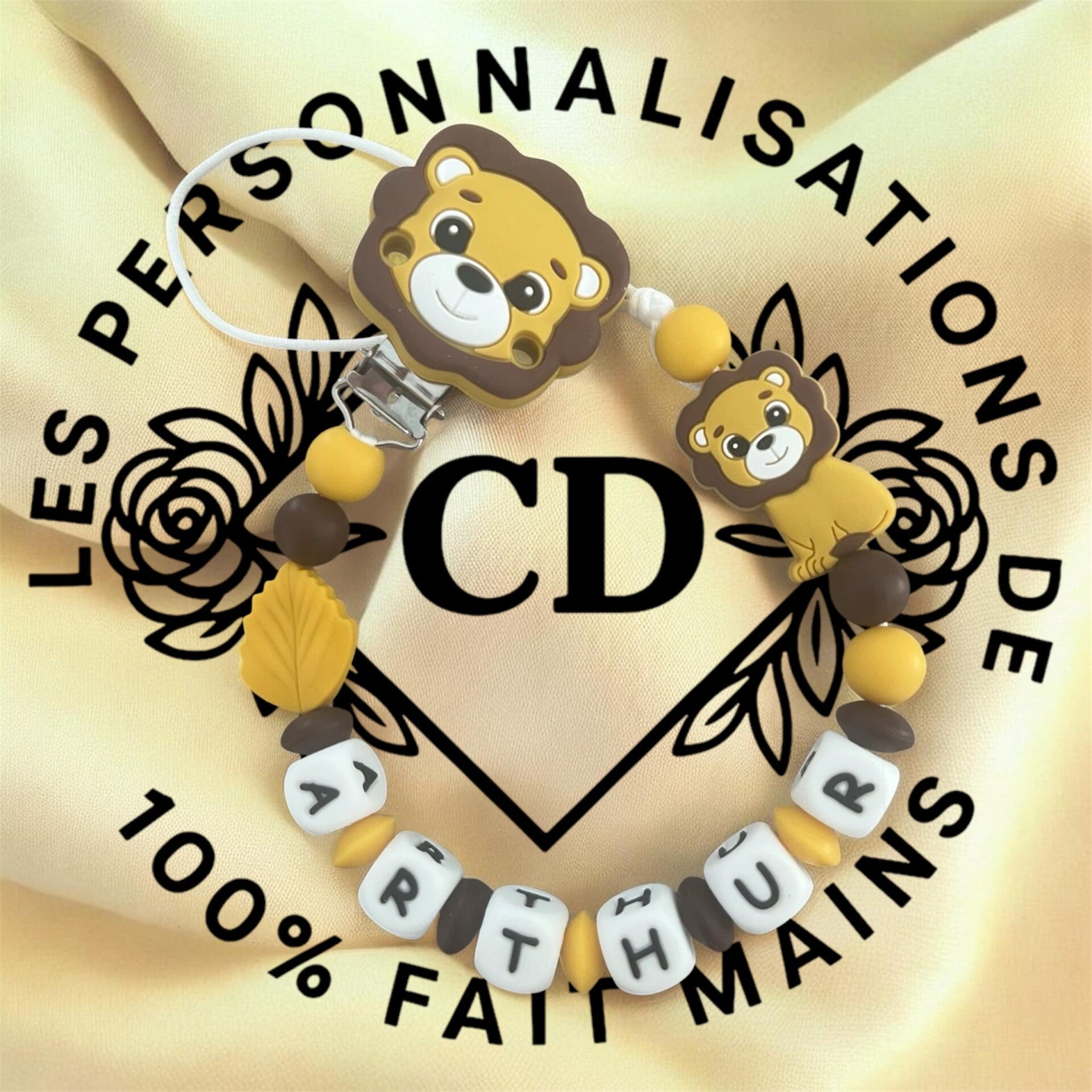 Attache tétine lion