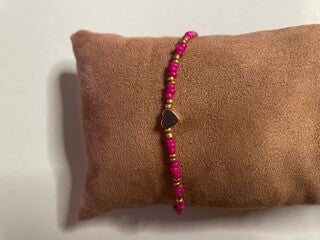 dark pink met gold armbandje
