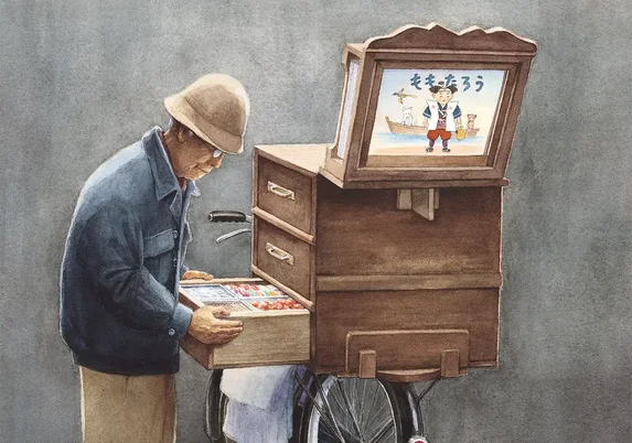 De kamishibai-man van Allen Say bekijkt zijn snoepjes