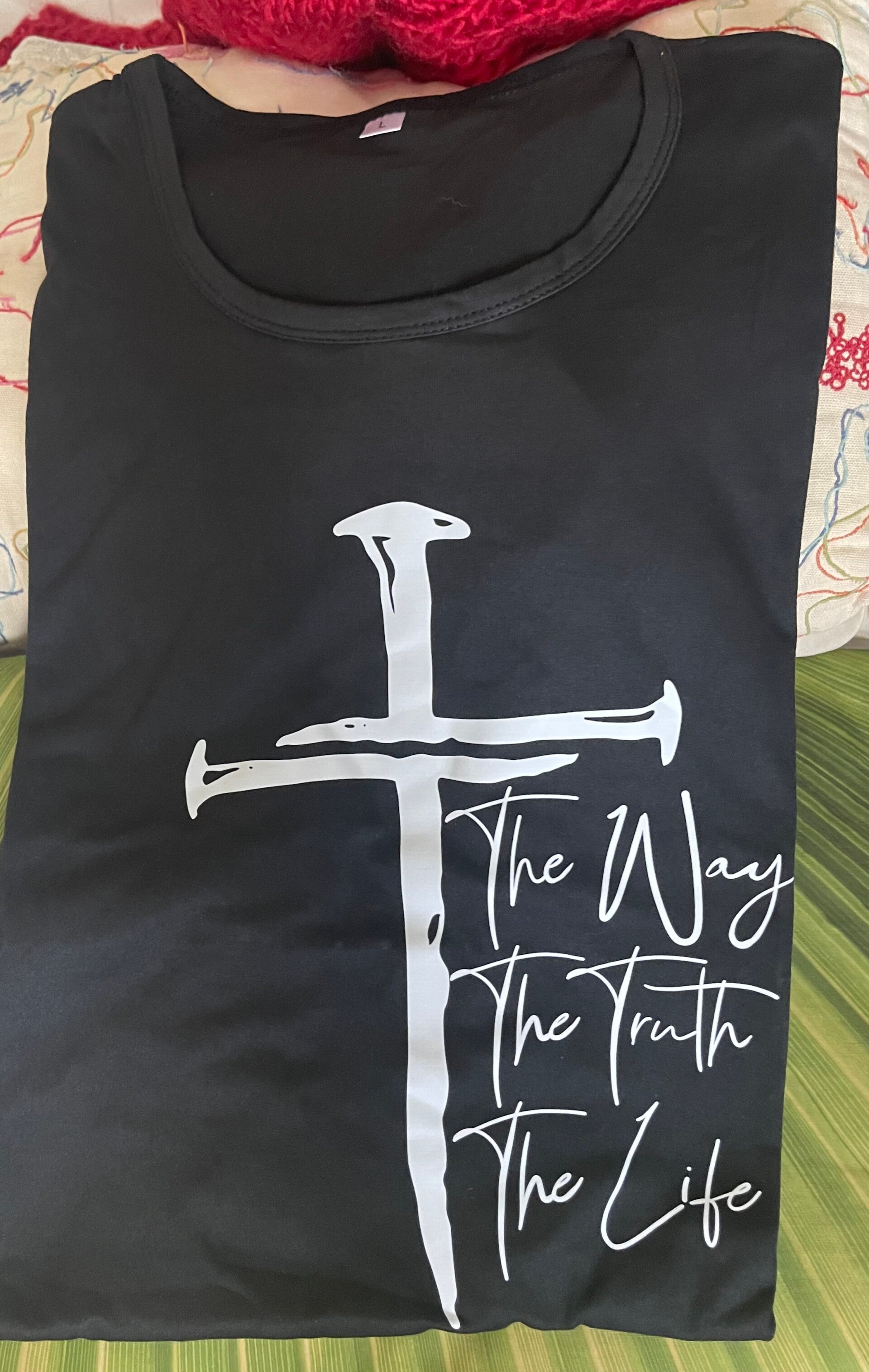 Female black large t-shirt with msg of the cross