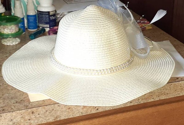 Light cream color straw floppy derby style hat