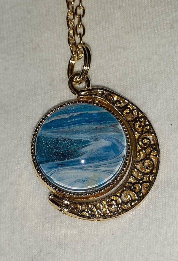 Small gold doubled sided moon necklace