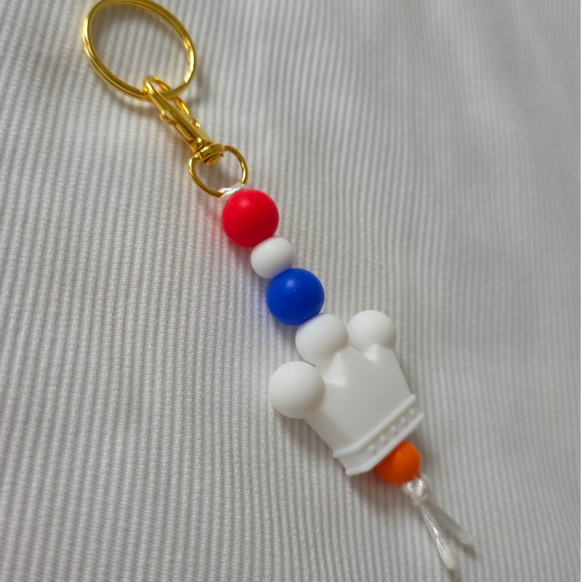 Rood/wit/blauwe sleutelhanger met kroontje