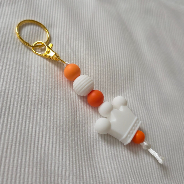 Oranje sleutelhanger met kroontje