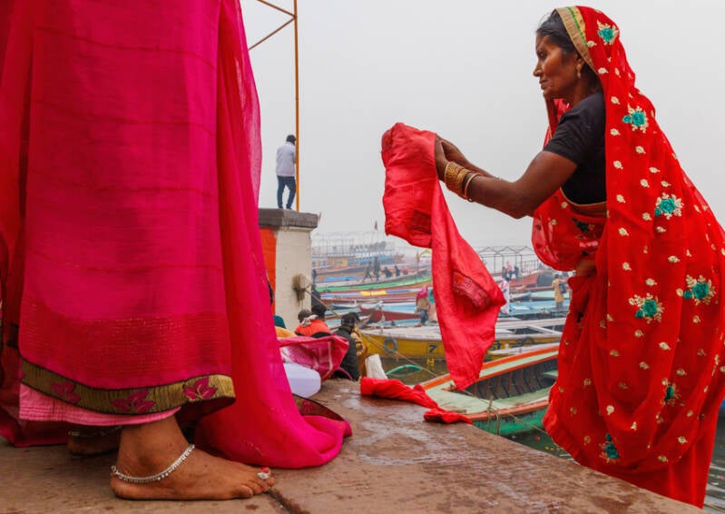 Women changing on the steps in Varansi