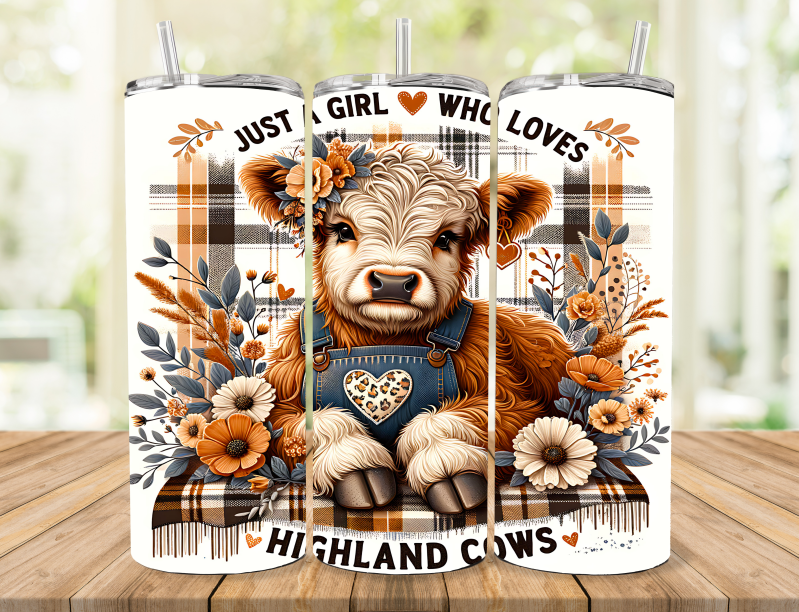 A highland cow  laying on a blanket with flowers