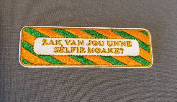 Embleem: Zak van jou unne selfie moake?  KR076