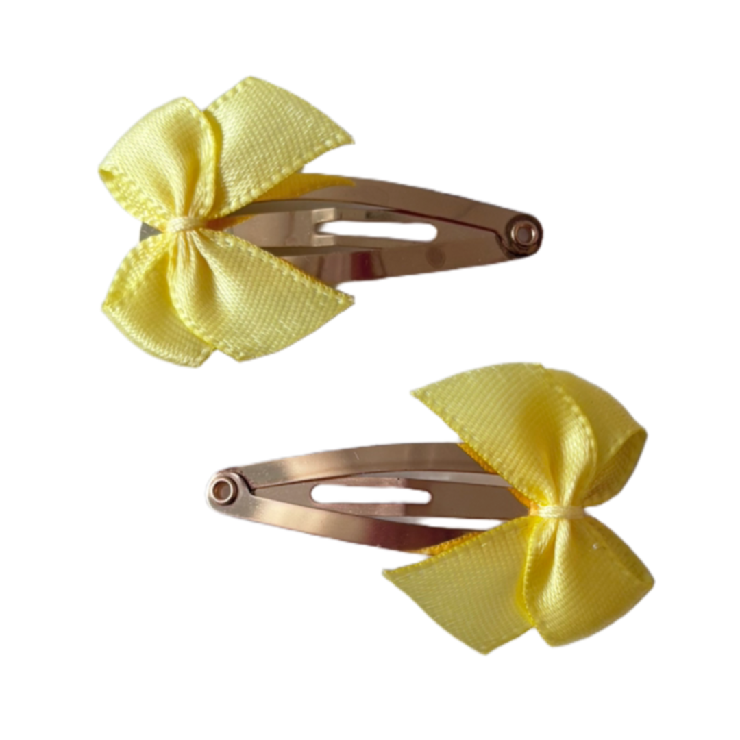 Gele strik speldjes (2 stuks)