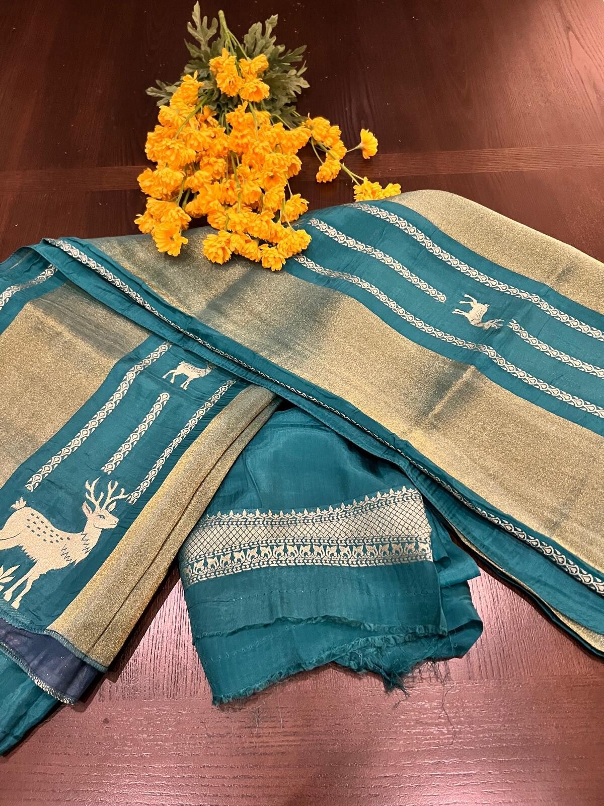 104 - Teal saree with Elk borders in Zari