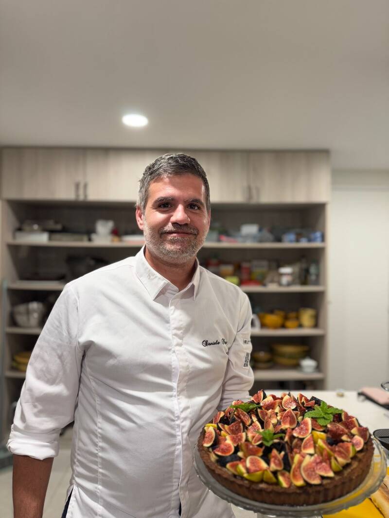 Chef Daniele Negri basting meat with premium butter – private chef service Saint-Tropez