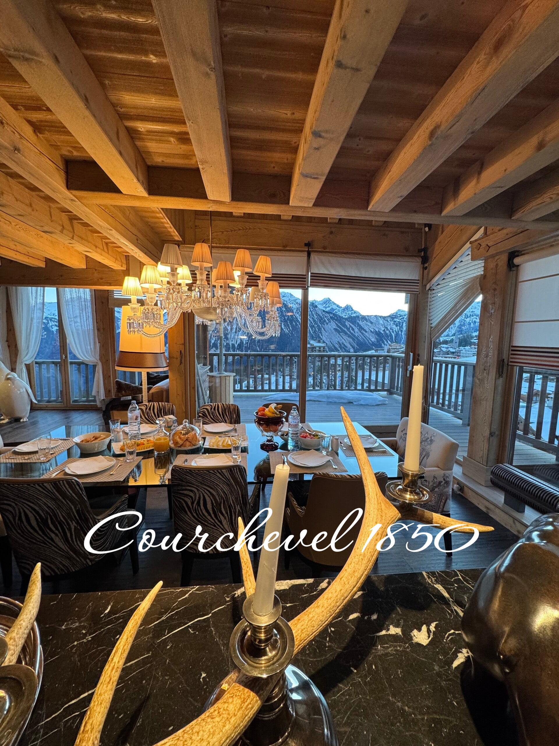 Atmosphere of a luxury mountain retreat in Courchevel, featuring warm wooden interiors and high-end culinary service.