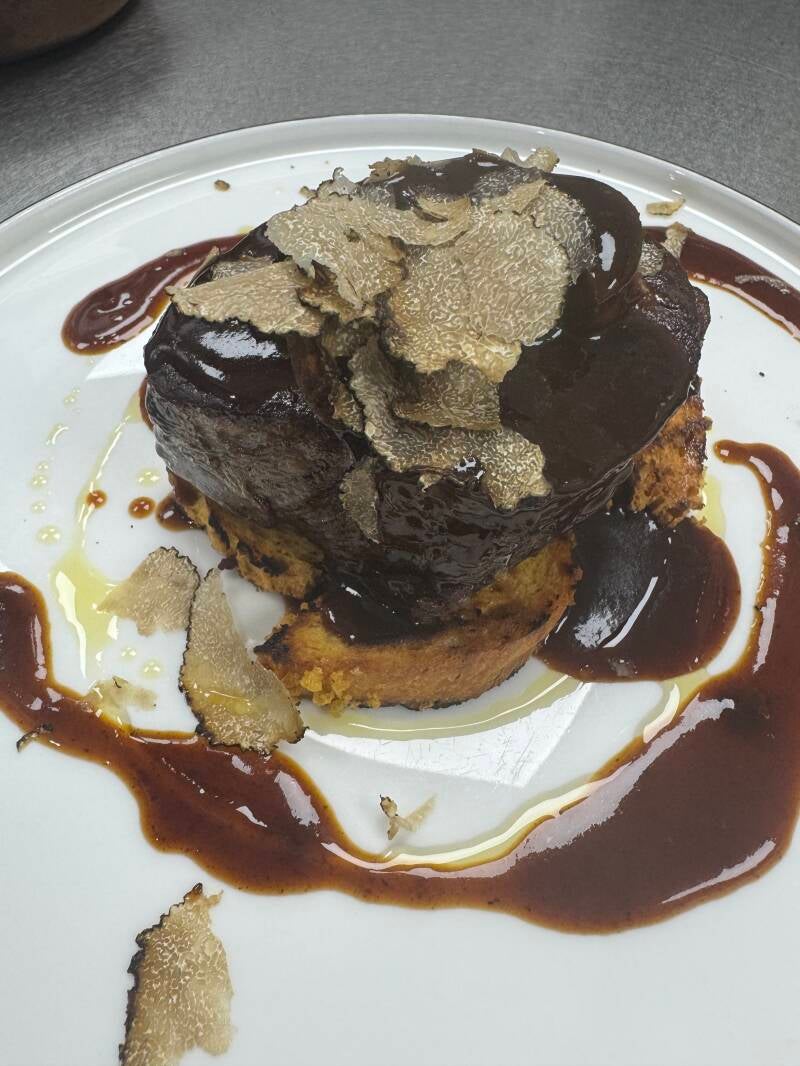 Gourmet beef tenderloin Rossini style with pan-seared foie gras and rich black truffle shavings.