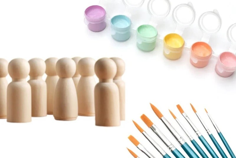 Verfstrips, blanco houten poppetjes en penselen