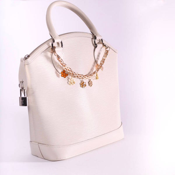 LV Alma epi leather ivory