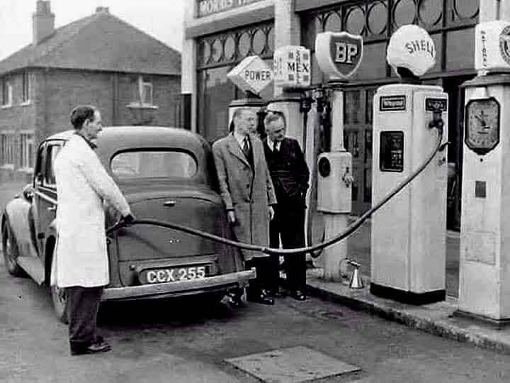 Old image of black and white  photo of petrol station