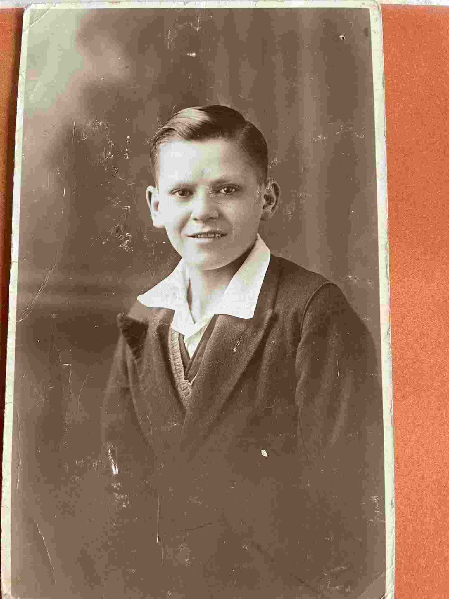 Original vintage photo of a boy in sepia