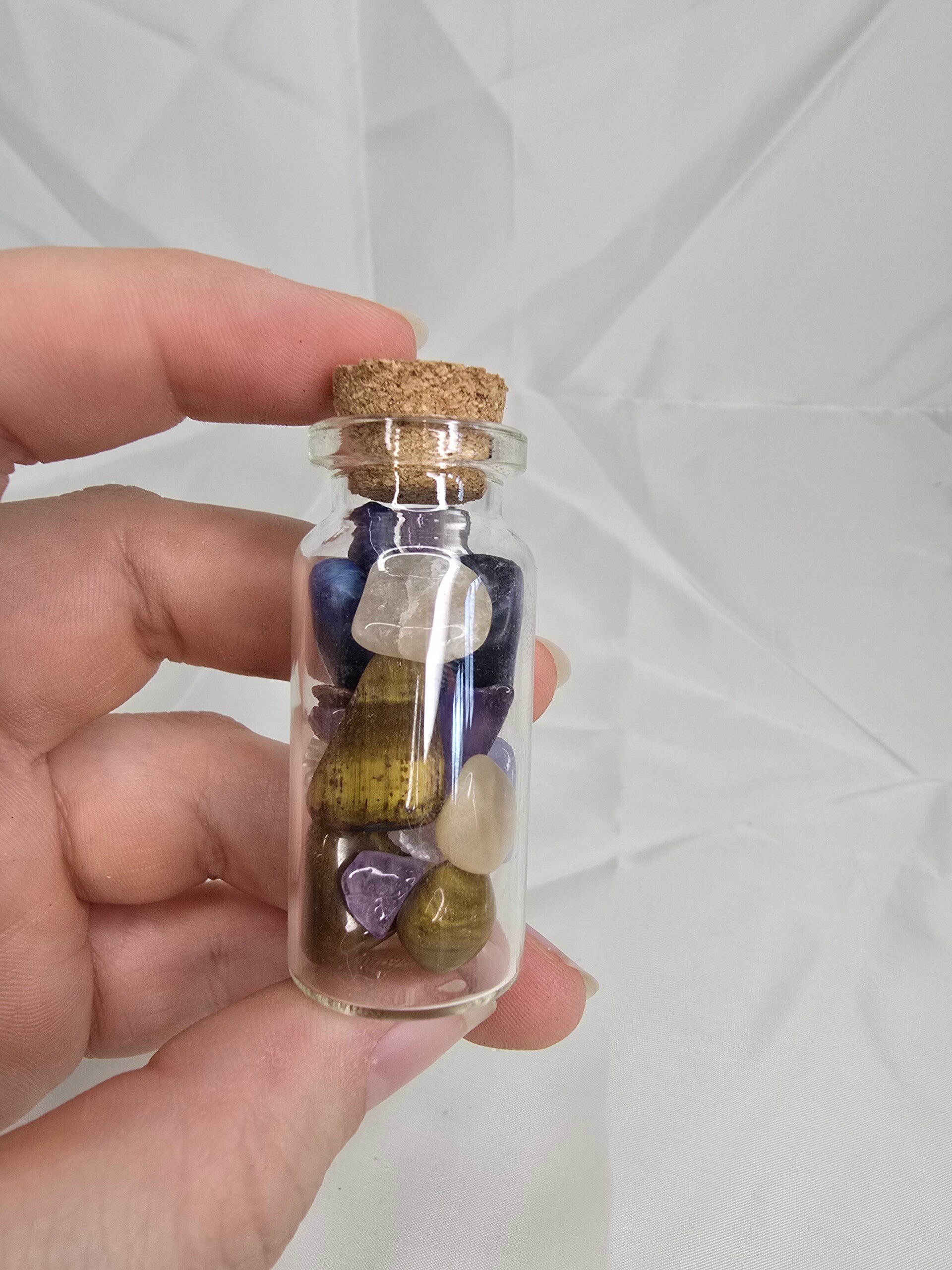 Koker met trommelstenen