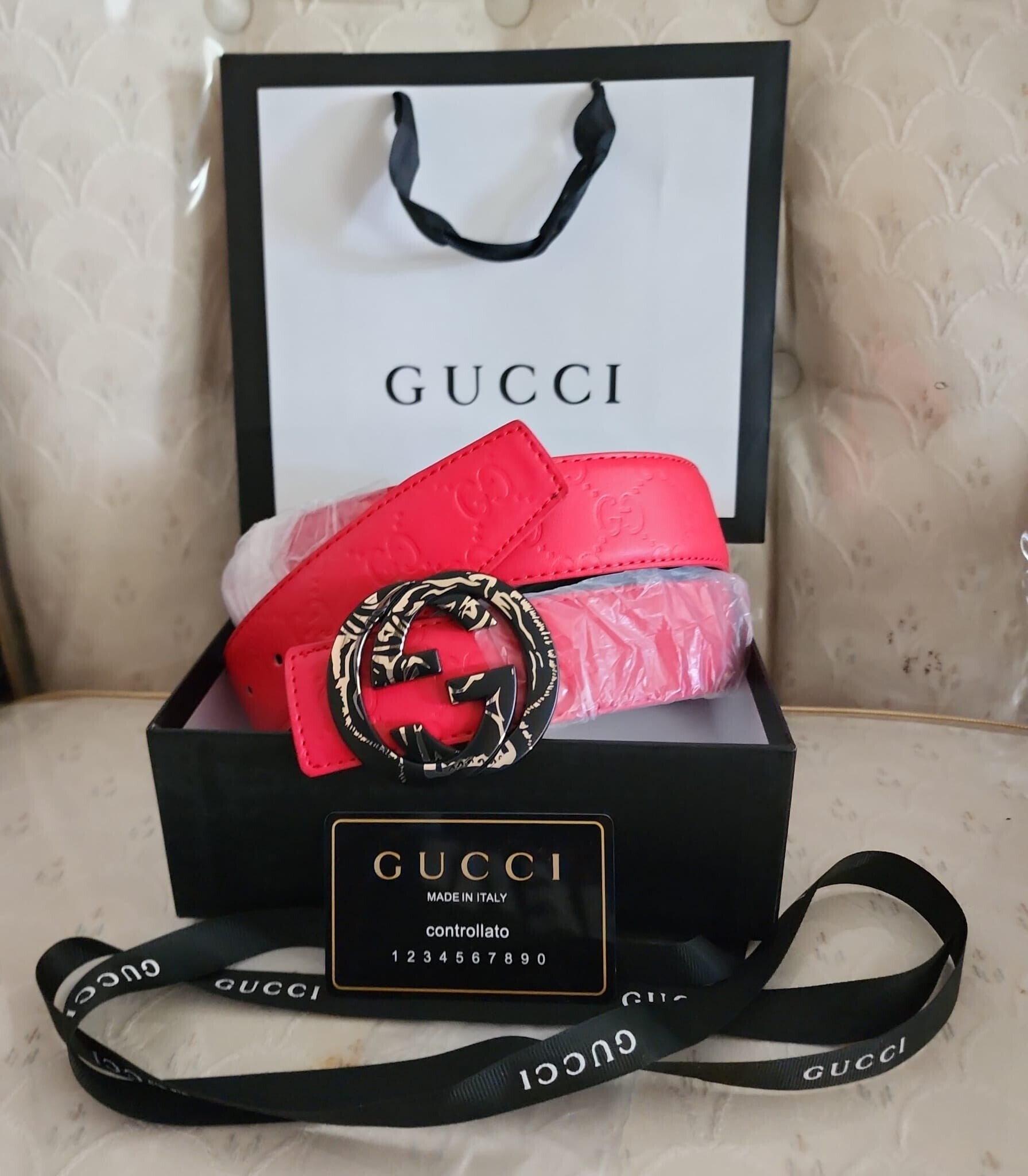 Women's Black Buckle Gucci Red Belt.