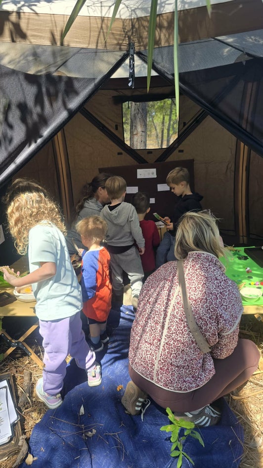 Children exploring toxic plant learning stations