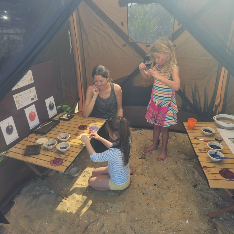Children painting berry models during toxic plant activity