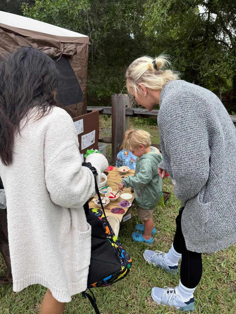 Children participating in toxic plant exploration stations