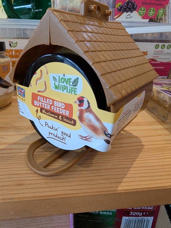 Filled bird butter feeder