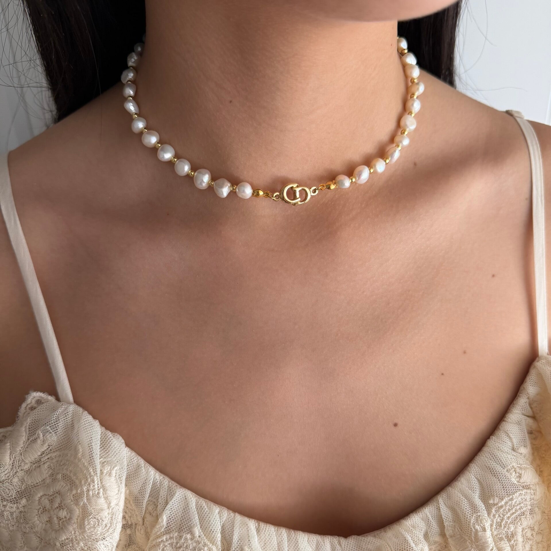Dior bracelet charm |  Necklace with pearls.
