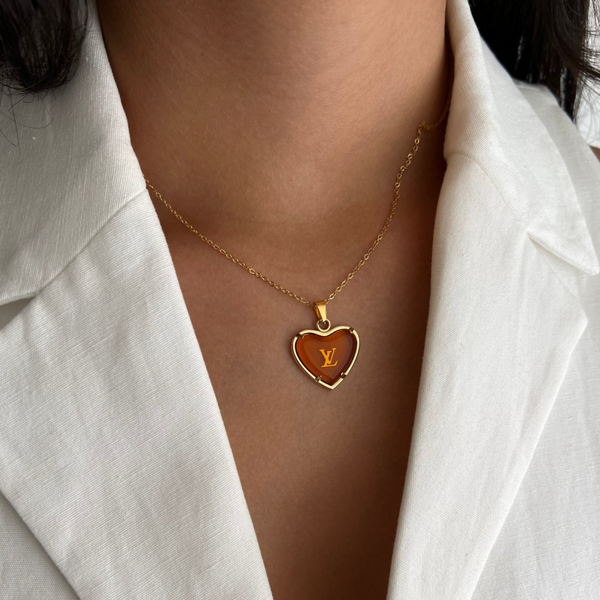 Authentic Louis Vuitton orange crystal heart charm - necklace.