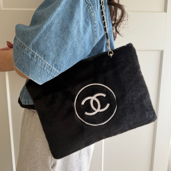 Vintage Chanel make-up pouch reworked into a bag.