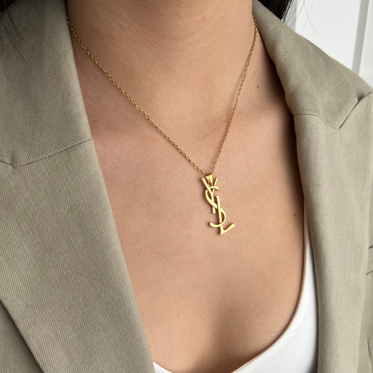 Authentic Yves Saint Laurent charm - necklace.