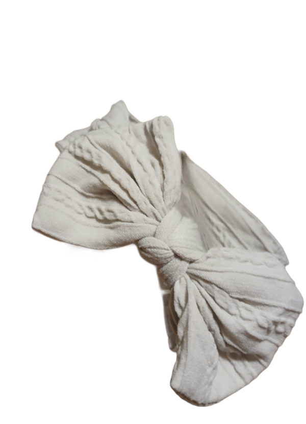 Baby Strechy Bow Headband. Beige. 14" Diameter.